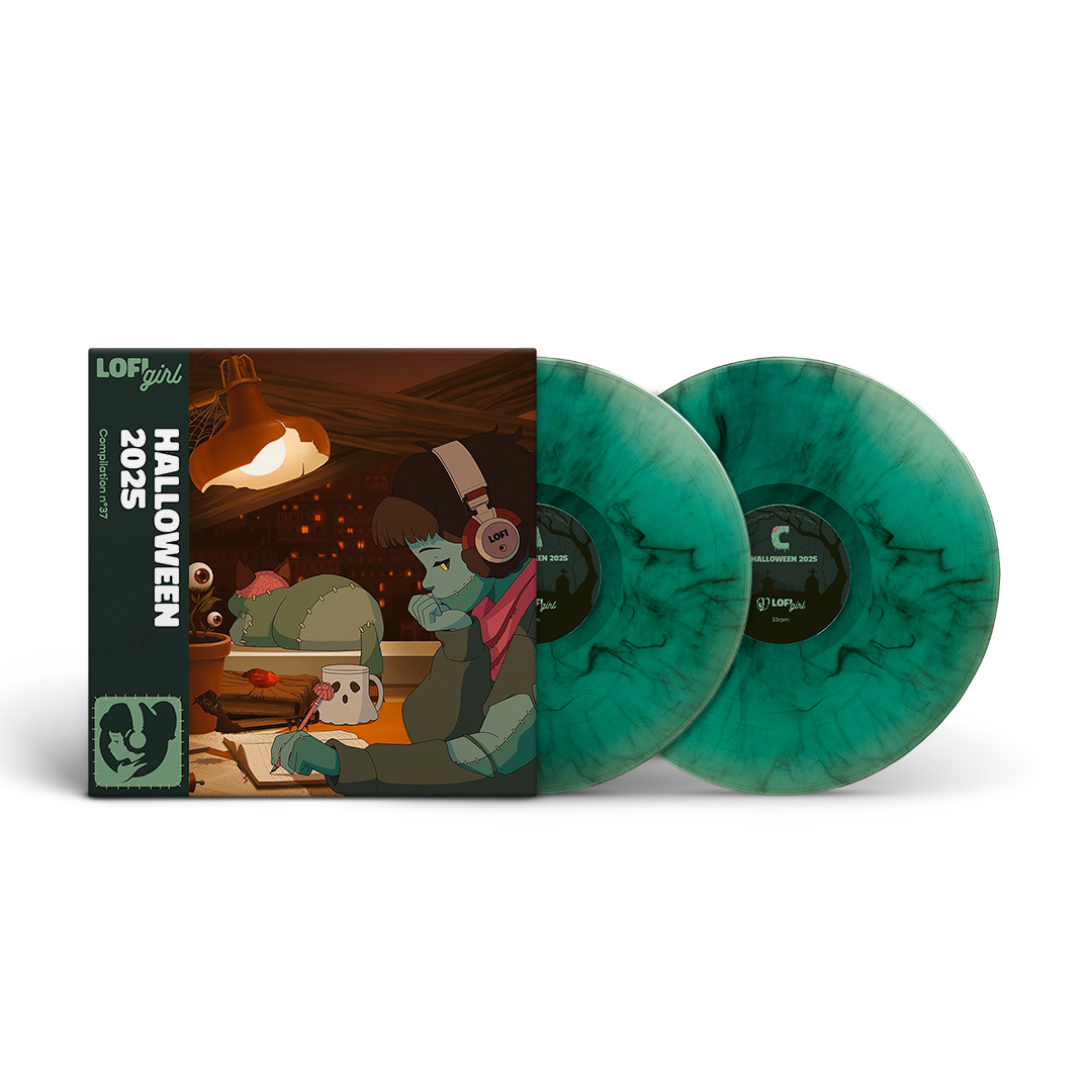 Vinyl records with green marbled design and Halloween-themed packaging on a white background