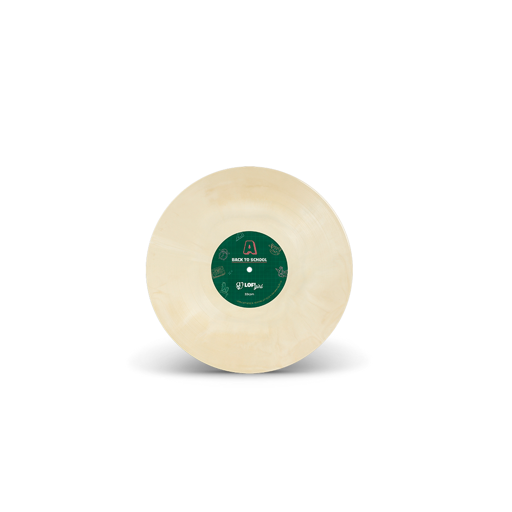Round beige object with a green label on a white background