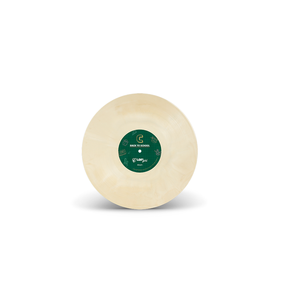 
                  
                    Round beige object with a green label on a white background
                  
                