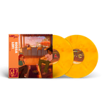 Vinyl records with orange sleeves featuring illustrations of people in a cafe setting.
