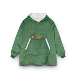 Green fleece poncho with cartoon character patches on a white background