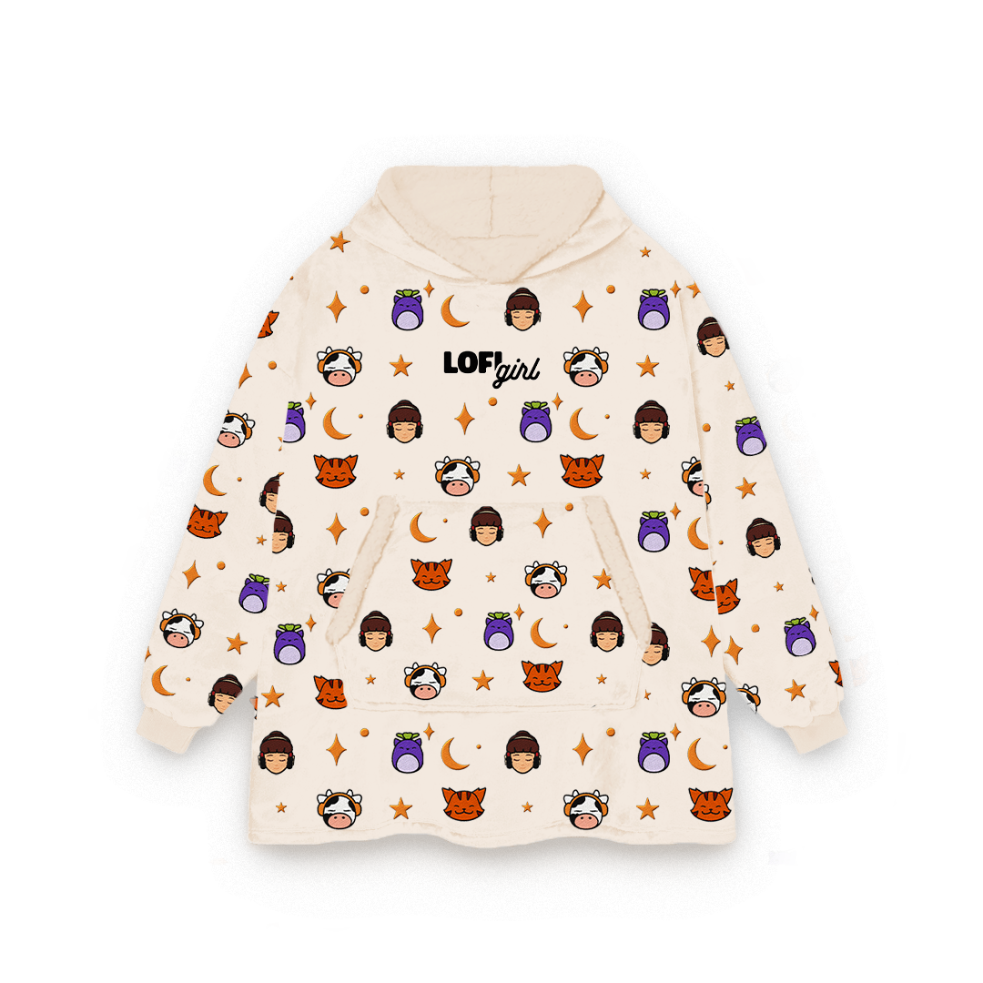 Lofi Girl Mascots Blanket Hoodie in beige, oversized wearable blanket with an all-over pattern of Lofi Girl, ChilledCow, Pocky the cat and Mochi, and an embroidered Lofi Girl logo