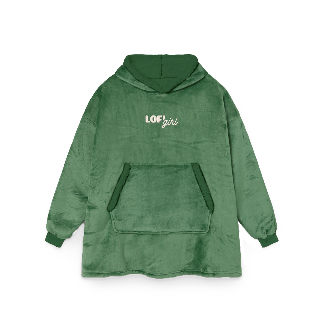 Lofi Girl Blanket Hoodie in green, oversized wearable blanket with an embroidered Lofi Girl logo on the chest and a big front pocket