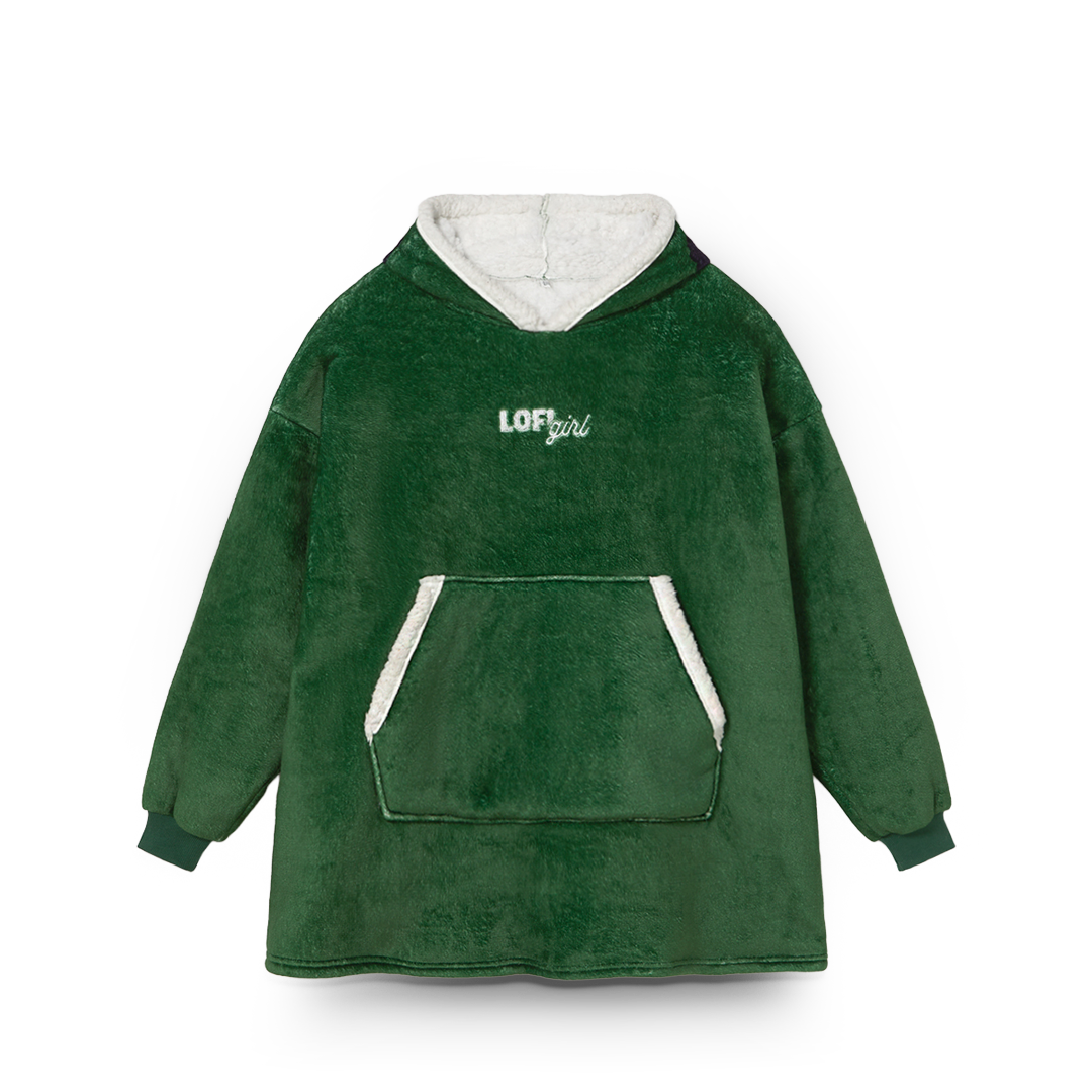 Green fleece poncho with white lining and 'LOFT girl' branding on a white background