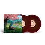 Vinyl records with a colorful cover featuring a person under cherry blossoms.