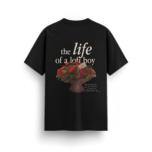 
                  
                    Black t-shirt with a graphic design and text on the back against a white background
                  
                