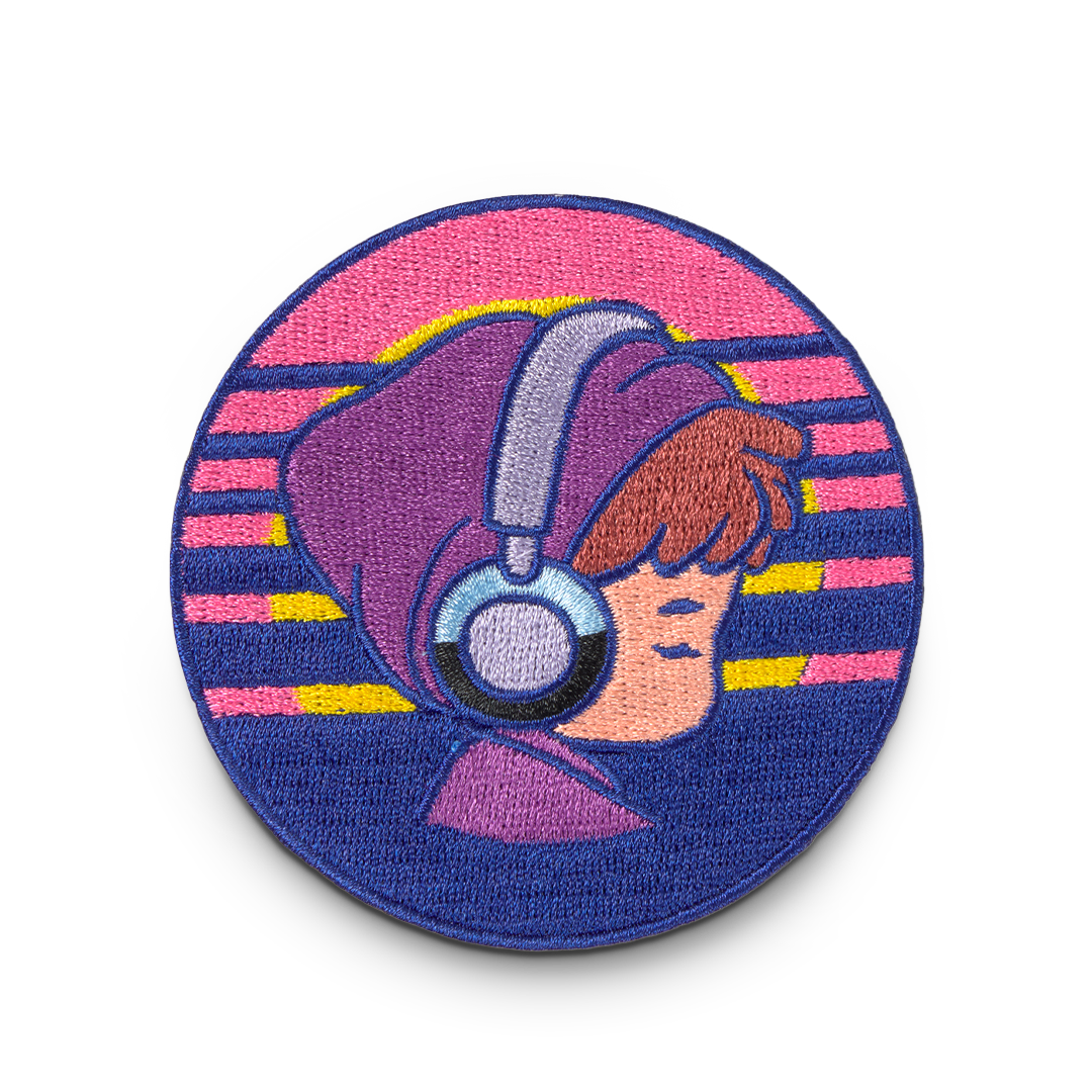 Circular patch with a stylized illustration of a person wearing headphones against a colorful striped background.