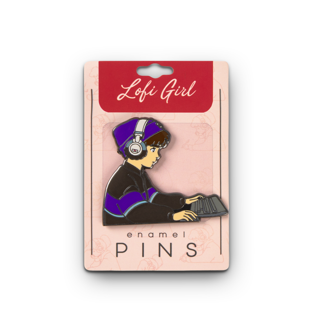 Enamel pin of a person with headphones and a book, on a 'Lofi Girl' branded card.