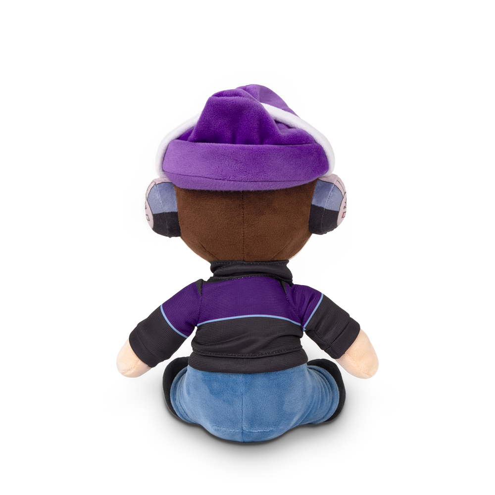 
                  
                    Plush toy with purple outfit and helmet on a white background
                  
                
