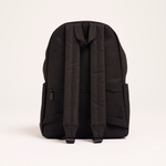 The back view of the black Lofi Boy backpack, showing the adjustable shoulder straps and a small zippered compartment.