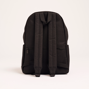 
                  
                    The back view of the black Lofi Boy backpack, showing the adjustable shoulder straps and a small zippered compartment.
                  
                