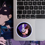 Round sticker featuring Lofi Boy with headphones, placed on a laptop keyboard.