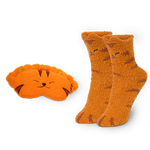 Pair of orange cat-themed socks and matching eye mask on a white background