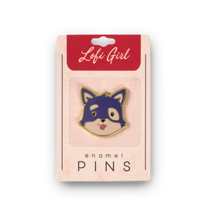 
                  
                    Enamel pin with a dog design in packaging labeled 'Lofi Girl'.
                  
                
