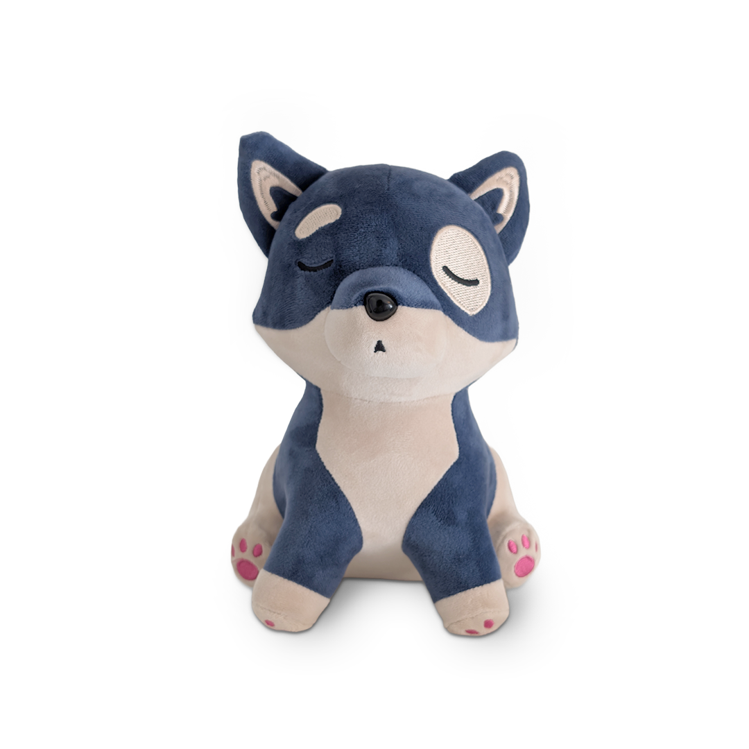 Plush toy fox with blue fur on a white background
