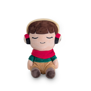 
                  
                    Plush toy with a child-like face wearing headphones on a white background
                  
                