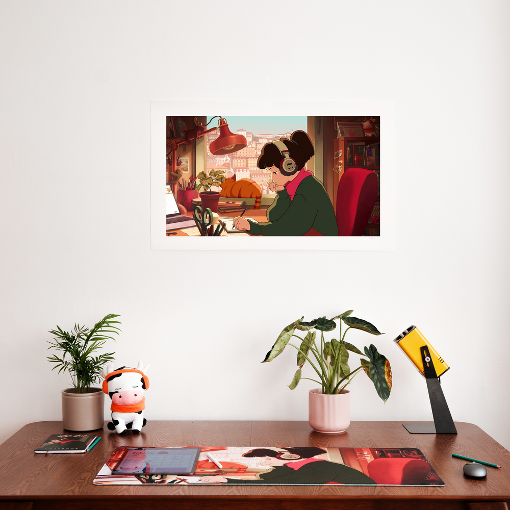 
                  
                    A Lofi Girl print mounted on the wall above a desk. The desk has plants, a plush toy, and a mouse pad featuring Lofi Girl artwork. The print shows Lofi Girl studying with a cat on the windowsill behind her.
                  
                