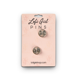 
                  
                    Two silver pins on a pink card with 'Lofi Girl Pins' branding.
                  
                