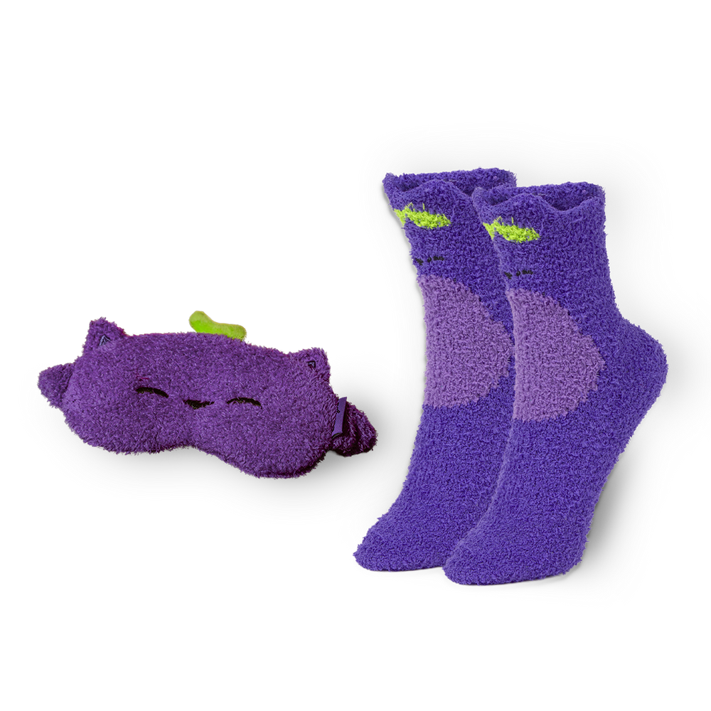 
                  
                    Pair of purple socks with a matching eye mask on a white background
                  
                