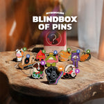 Introducing Blindbox of Pins: a mystery collection featuring various unique pin designs displayed on a wooden surface.