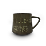 Brown mug with white text and graphics on a white background