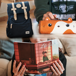 A collage of Lofi Girl merchandise featuring a navy blue backpack with beige straps and a Lofi Girl logo, an orange pencil case shaped like a cute animal being held by a hand, and a person reading a 'Lofi Girl' notebook with an illustration of a cozy room on the cover.