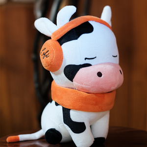 
                  
                    A side profile of the Chilled Cow plushie highlights its plush, soft fabric and endearing details, like the embroidered logo on the earmuffs. It’s the perfect plushie for moments of peace and reflection.
                  
                