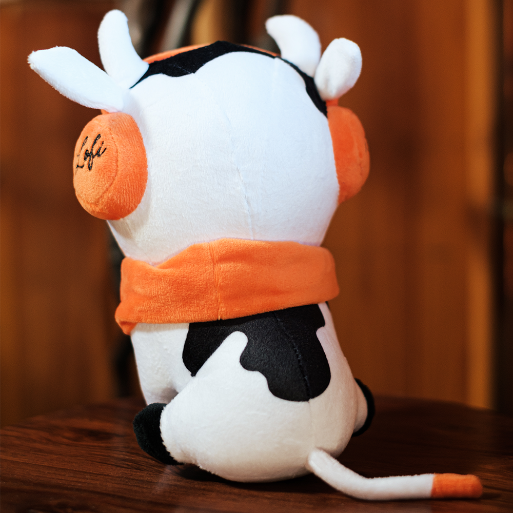 
                  
                    The back view of the Chilled Cow plushie, showcasing its fluffy tail and spotty design, captures its whimsical charm. Every angle of this plushie brings a sense of fun and comfort.
                  
                