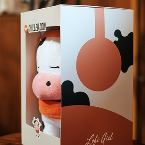 
                  
                    A peek from the side of the packaging shows the Chilled Cow plushie in its snug, branded box. It’s a perfect gift for anyone who appreciates cute and quirky collectibles.
                  
                